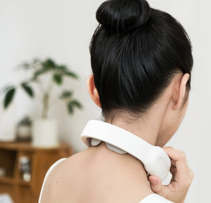 Close-up of a Cervical & Shoulder Massager with an intelligent remote control. Features include soothing heat therapy, customizable massage modes, and ergonomic design for targeted relief at home.